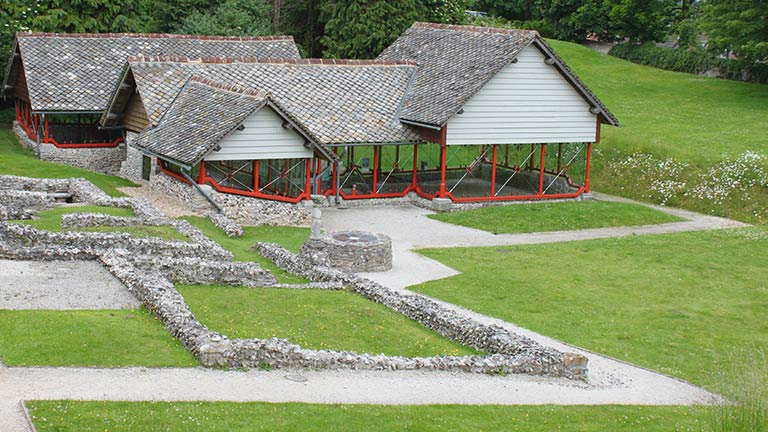 The Roman Town House attraction in Dorchester with old Roman remains and a building protecting original Roman mosaics in the background