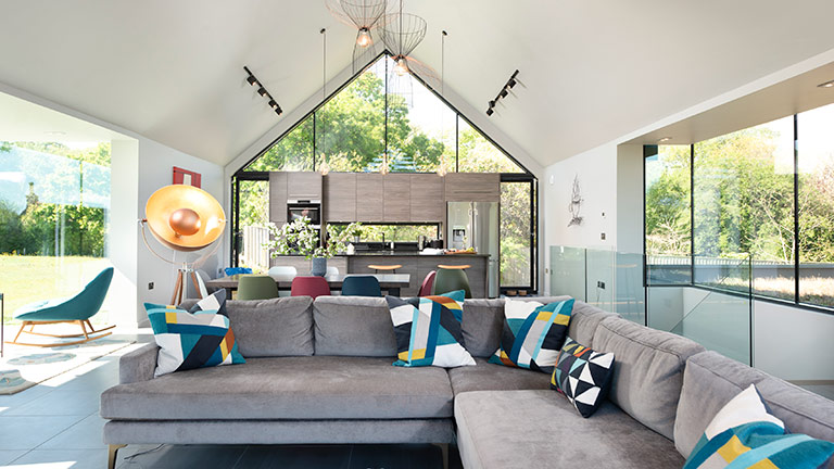 The glass-fronted, contemporary living area of Bellevue, Lulworth Cove | Boutique Retreats