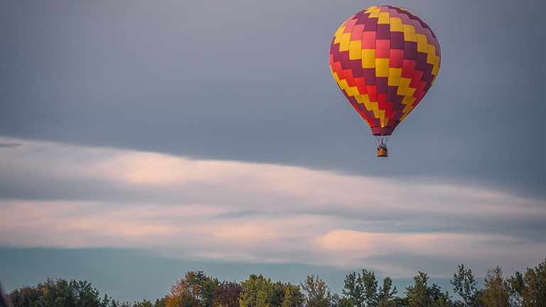 A hot air balloon drifting in the sky 