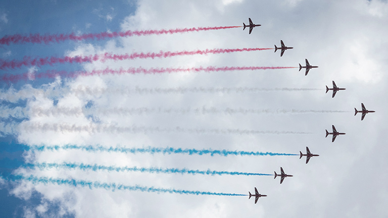 The red arrows flying overhead with red, white and blue trails