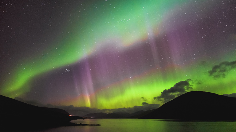 The Northern Lights lighting the sky over Loch Glascarnoch