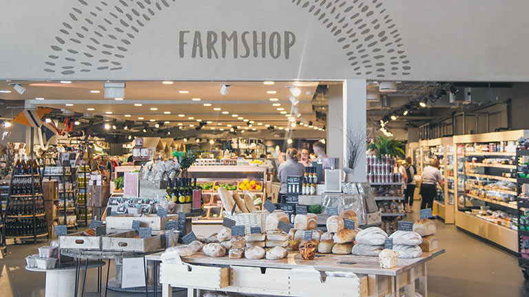 The entrance of Gloucester Services Farm Shop arranged with foodie displays