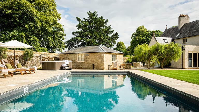 The beautiful swimming pool in the grounds of Spellbound, Cirencester | Boutique Retreats