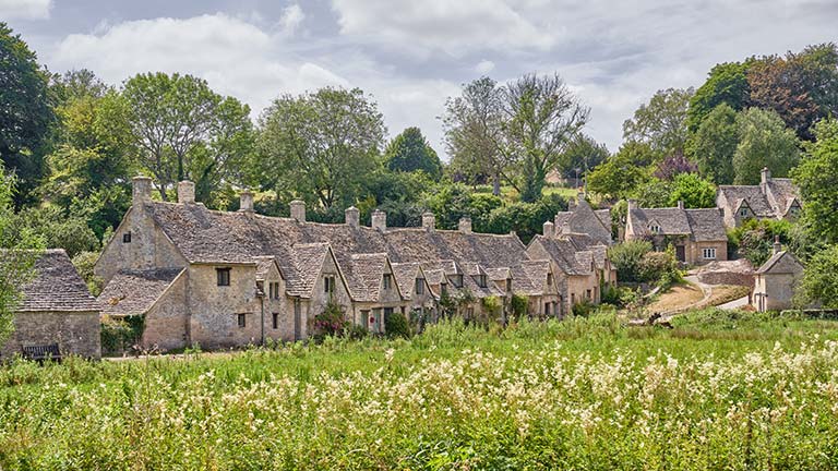 Arlington Row's fourteenth century cottages, enjoyed during a pub walk in the Cotswolds