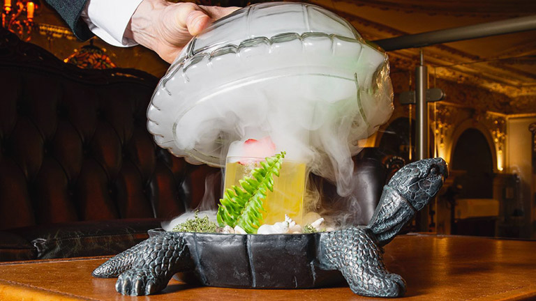 A cocktail served in a model turtle with dry ice in Incognito cocktail bar in Winchester