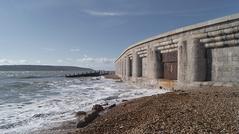 The outer walls of Hurst Castle lapped by the sea at high tide in Hampshire