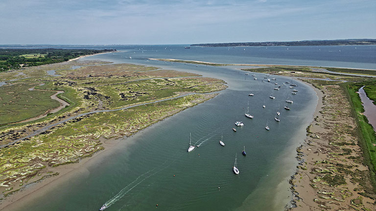 Boats moored in at the mouth of the Beaulieu River