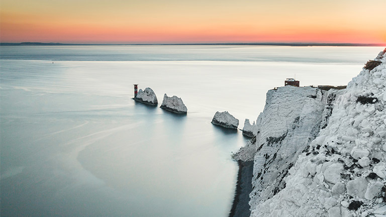 The iconic rock formations at The Needles at sunset on the Isle of Wight