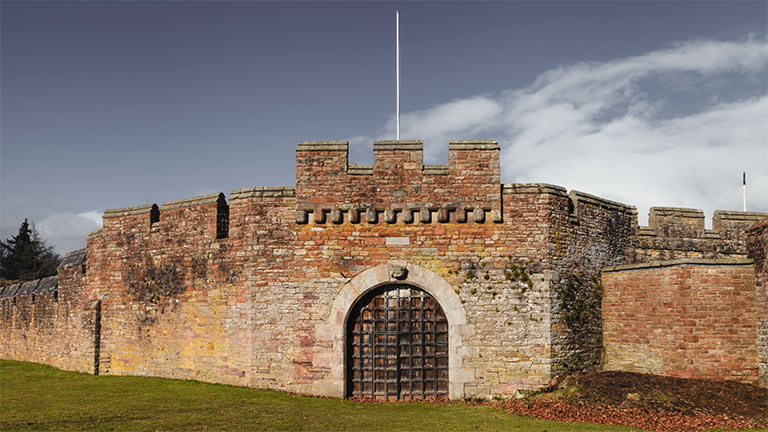 The exterior stone walls of Brougham Castle in Penrith