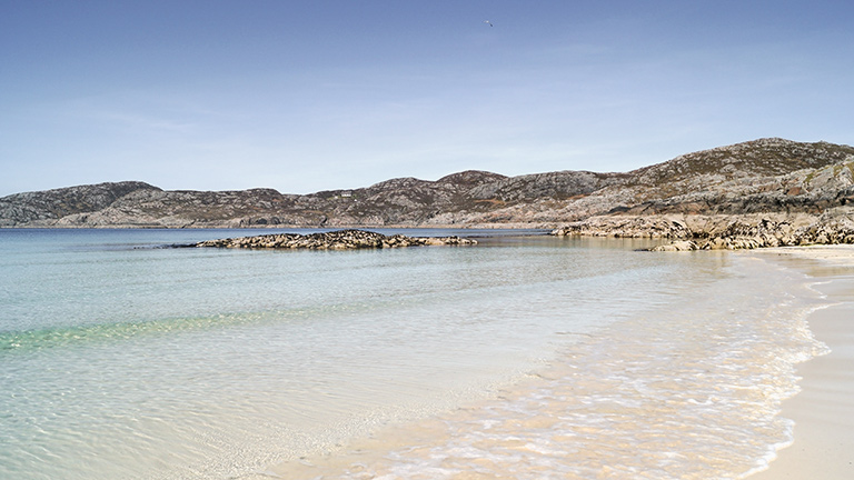 The white sands and turquoise waters of Achmelvich Bay