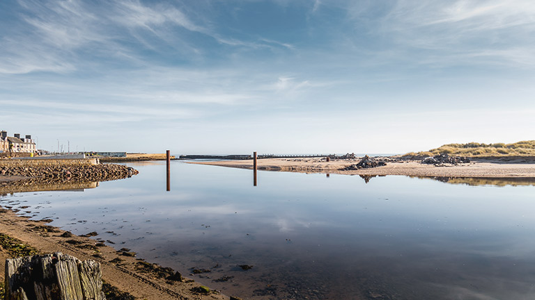 Beautiful reflections in the water at Lossiemouth East Beach