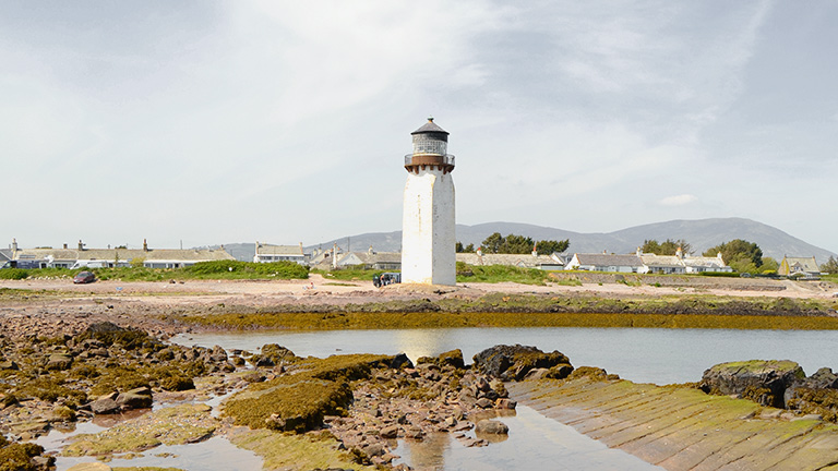 Southerness Beach Lighthouse above the beach