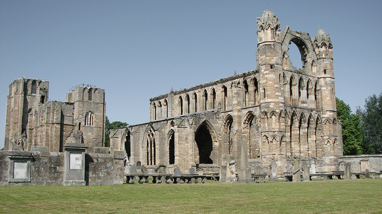 The remains of Elgin Cathedral in Moray under blue skies