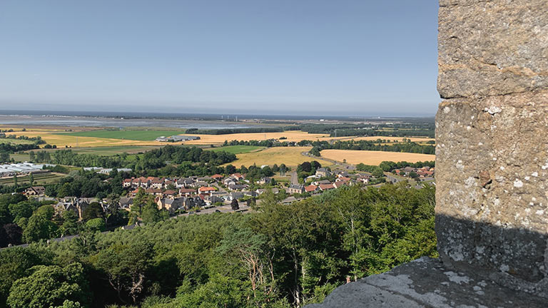Far-reaching views over verdant landscapes towards the sea from the top of Nelson's Tower 