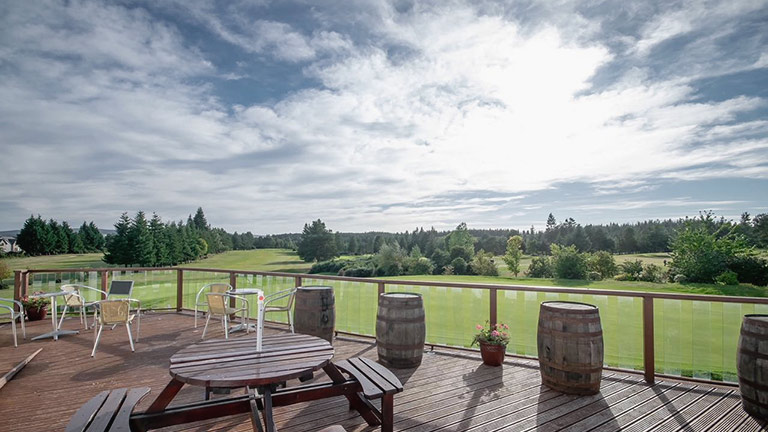 The suntrap terrace and golf course of Elgin Golf Club