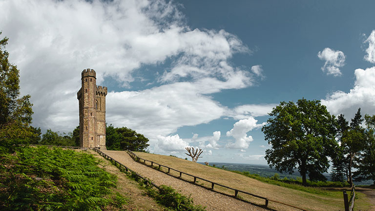 A view of Leith Hill Tower under blue skies in Surrey