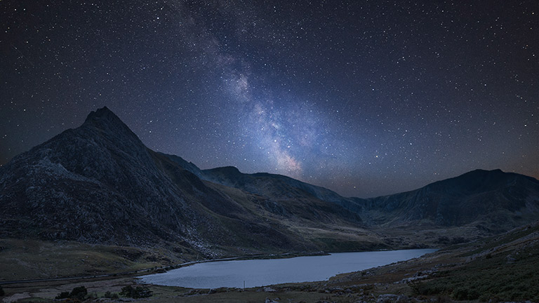Beautiful stars and the Milky Way over Llyn Ogwen in Snowdonia (Eryri) National Park