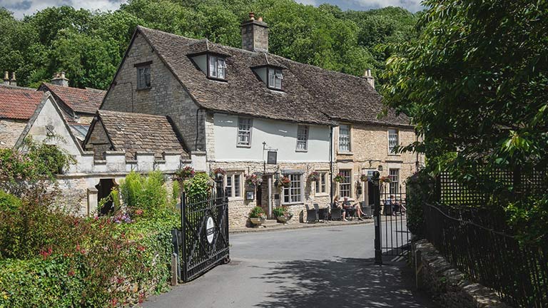 The traditional frontage of the historic Castle Inn in Castle Combe