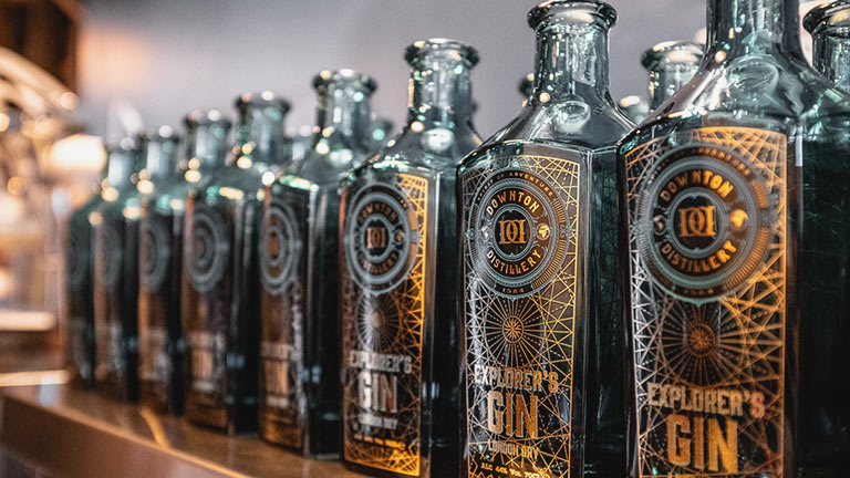 A row of stylish gin bottles at Downton Distillery in Wiltshire