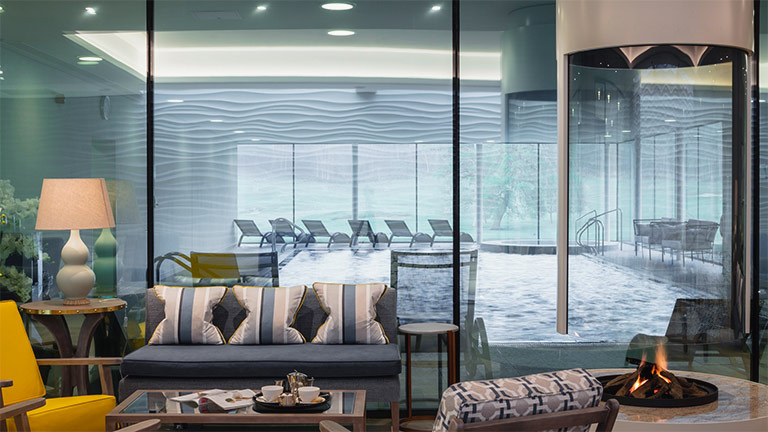 The glass-fronted welcome lounge and pool of Bowood Estate Spa in Wiltshire