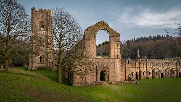 The old abbey remains of Fountains Abbey in Yorkshire in winter