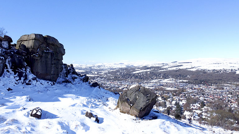 The cow and calf rock formations on Ilkley Moor in Yorkshire covered in snow