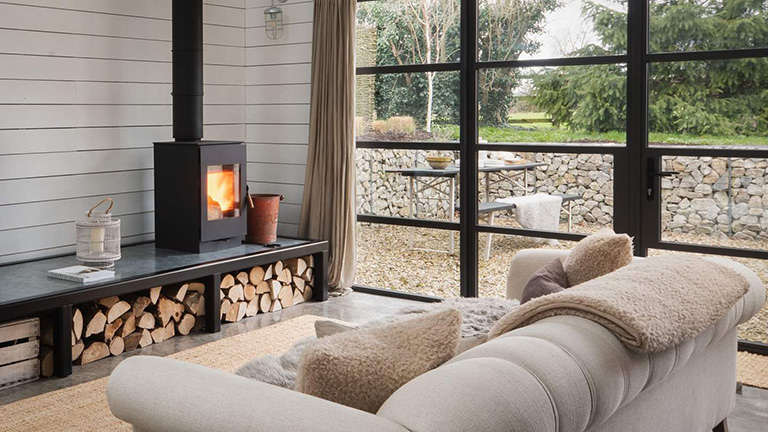 A warming wood burner in the living area of The Grey Shed, Yorkshire