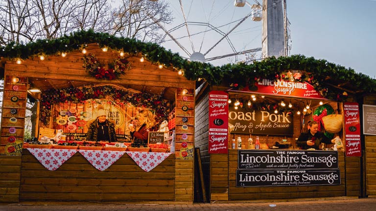 Wooden chalets serving delicious food at Harrogate Christmas Fayre