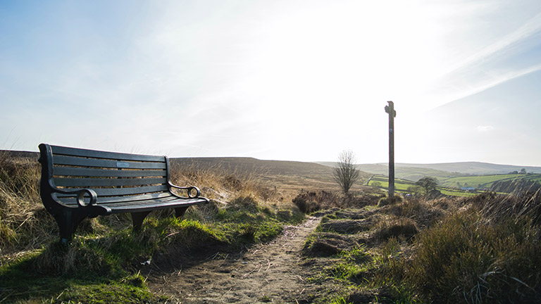 A bench on the side of the trail along the Bronte Way in Yorkshire