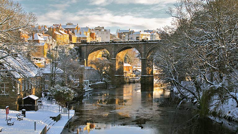 A beautiful view of Knaresborough and its historic bridge all coated in snow
